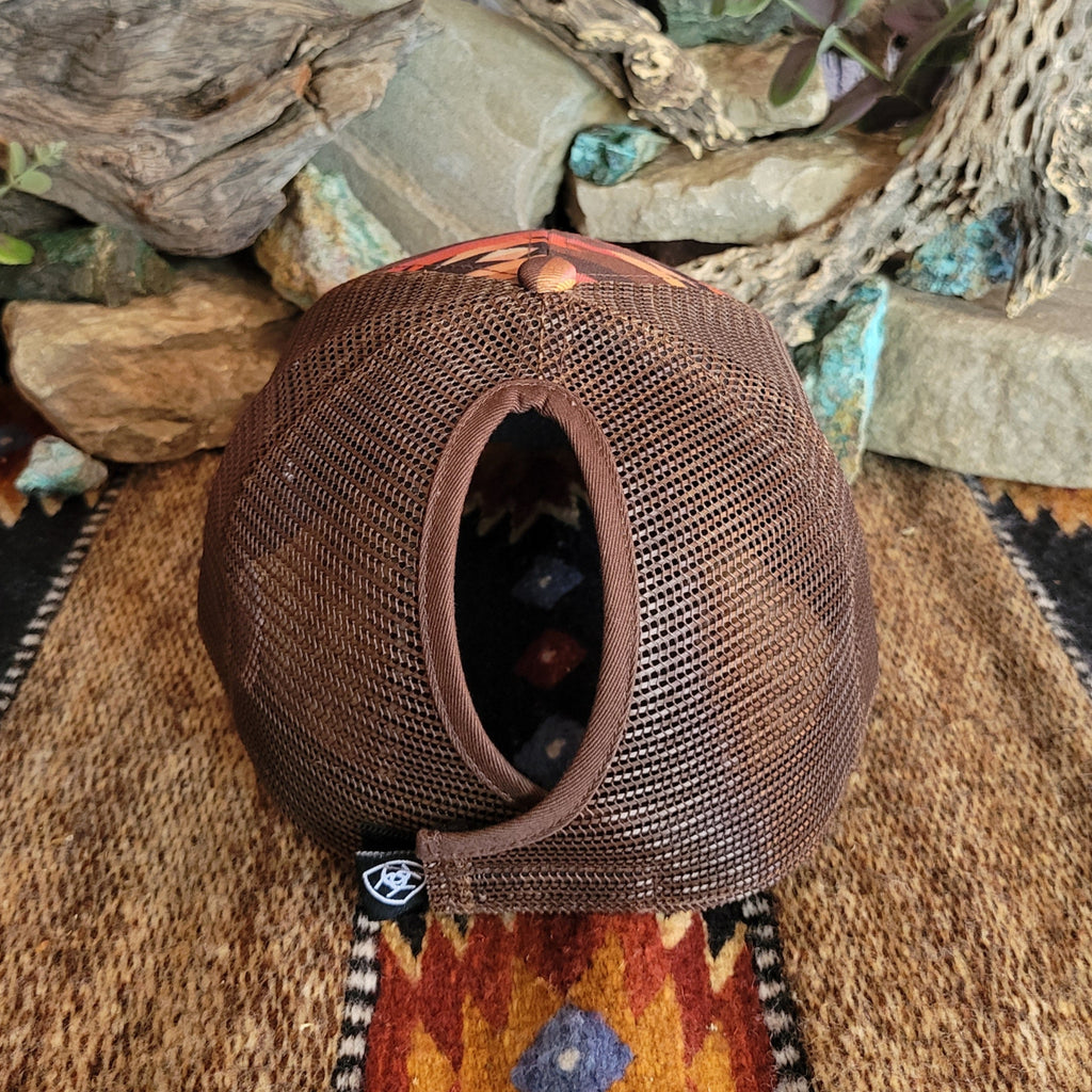 The back of cap features a mesh panel with adjustable Velcro strap and ponytail opening.