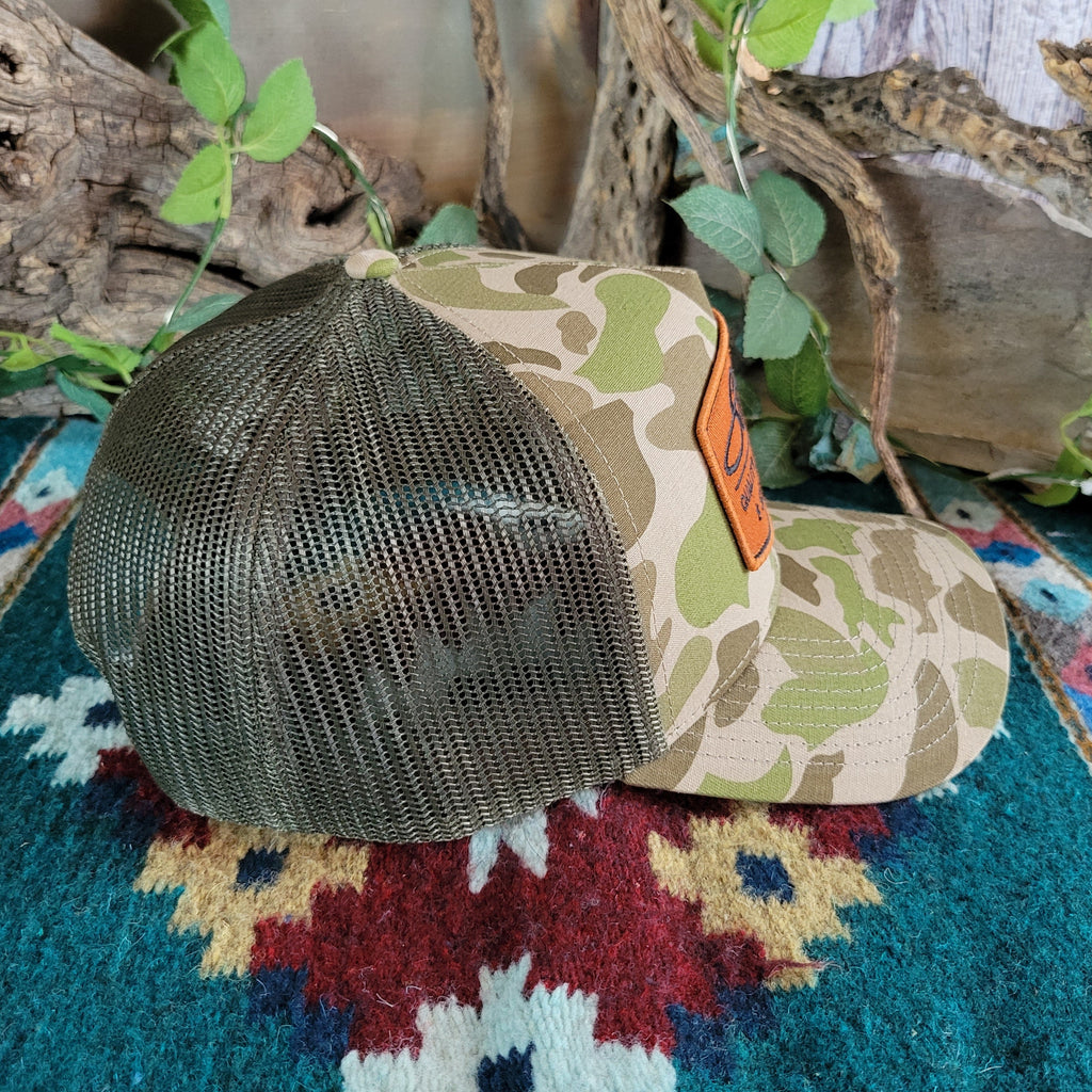 Green side mesh paneling on the cap.
