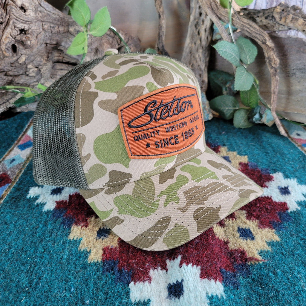 Camouflage print trucker cap with Stetson patch on the front.