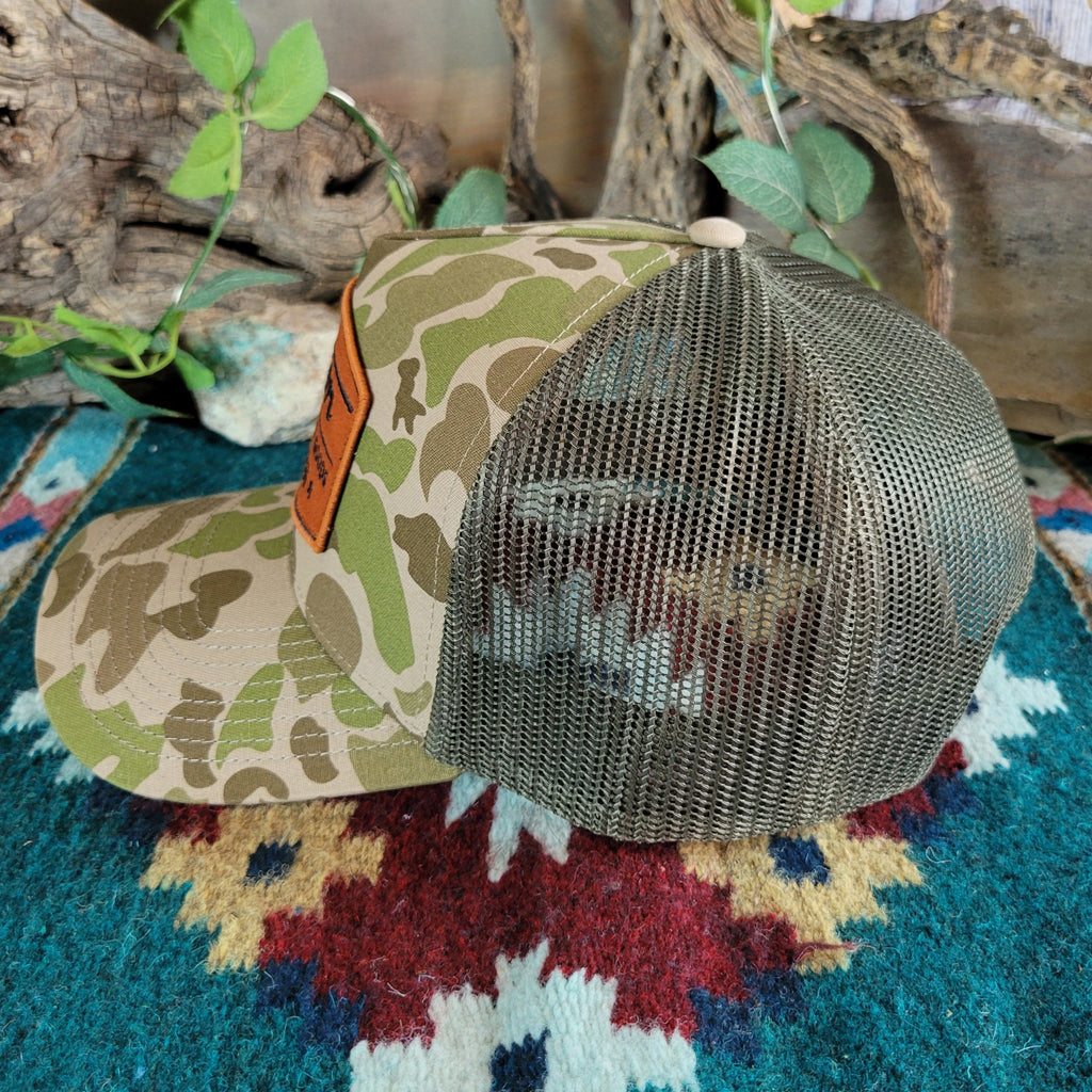 Green side mesh paneling on the cap.