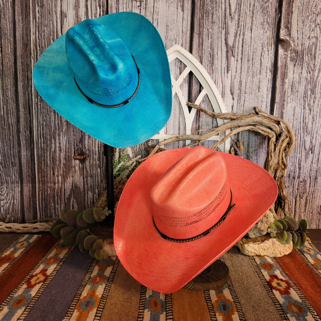 Partial aerial view of both the blue and coral straw hats.