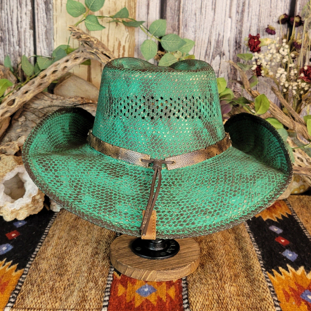 Rustic teal straw hat with leather cords of the band on the back.