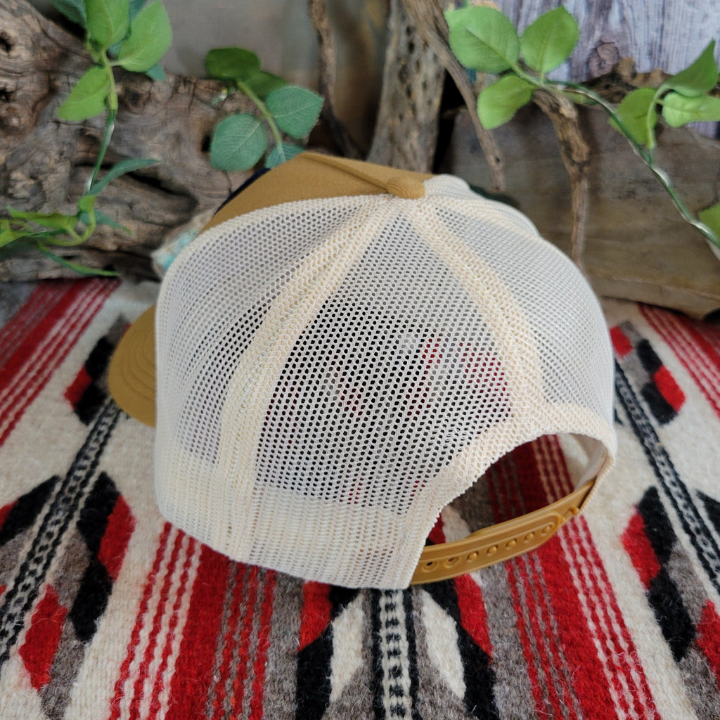 The back features an adjustable snap-back closure and white mesh paneling.