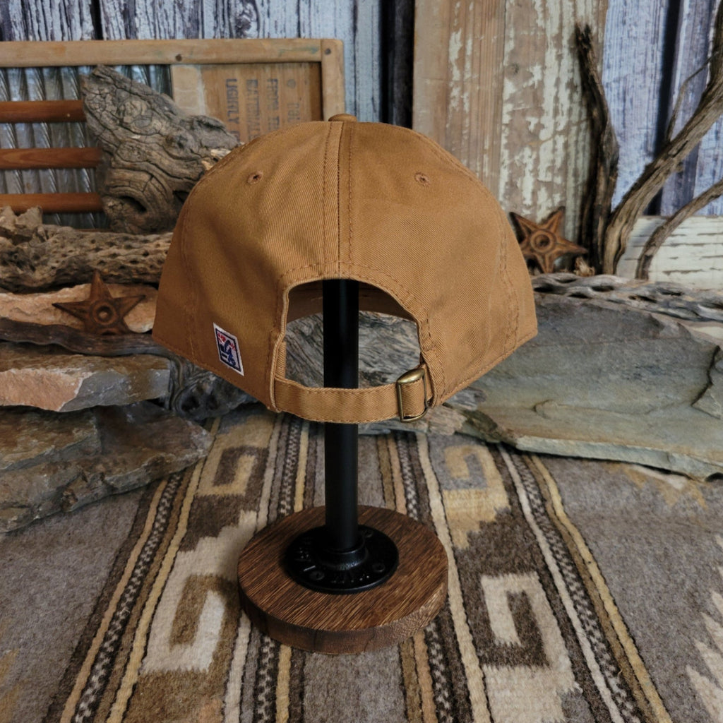 Back view showcases the tan cap with adjustable closure.