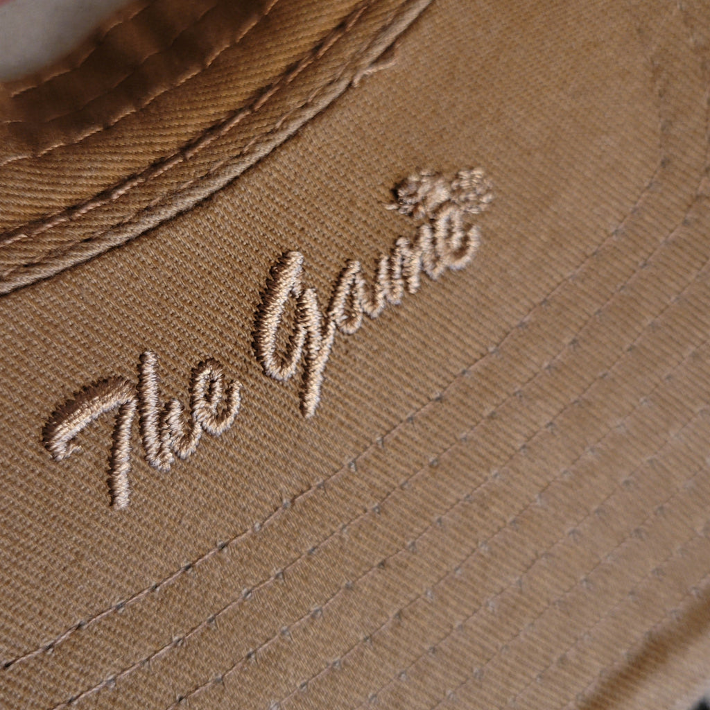 Embroidered logo on the inside of the cap's bill.