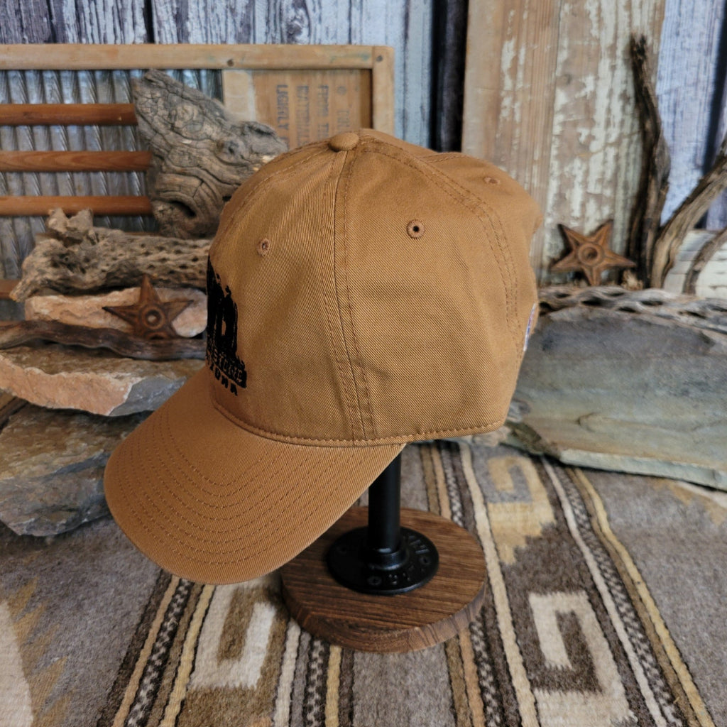 Tan cap with a curved bill, showcasing clean stitching.
