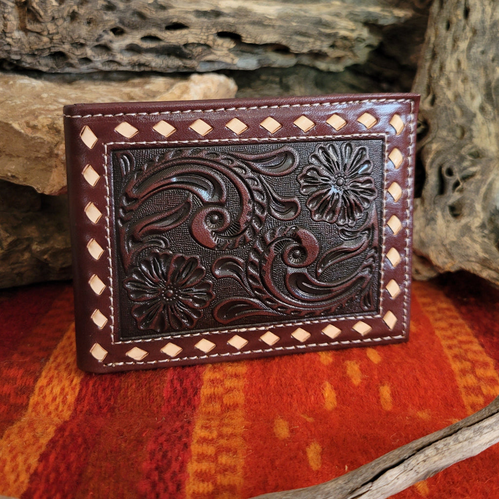 Dark brown leather wallet with tooled vine patterns.