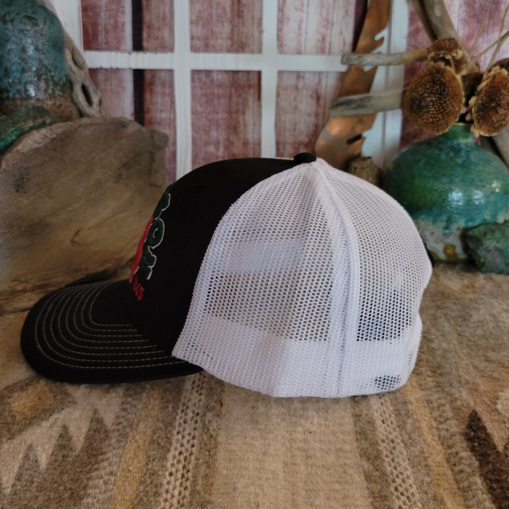 Side view of the hat showing the black fabric with white mesh panel.