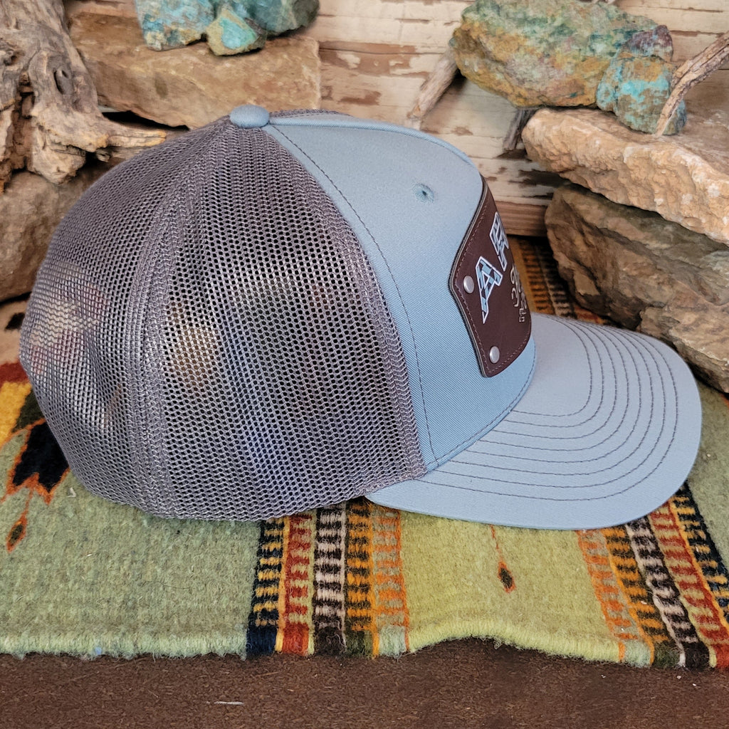 The side of the hat showcases the gray mesh paneling.