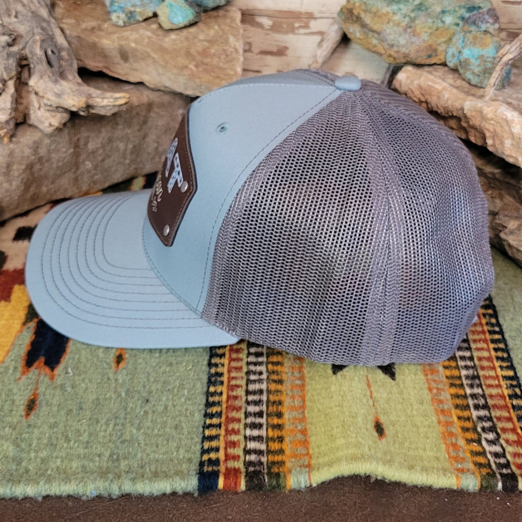The side of the hat showcases the gray mesh paneling.
