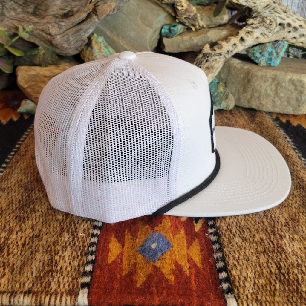 A white trucker cap with mesh paneling on the sides.