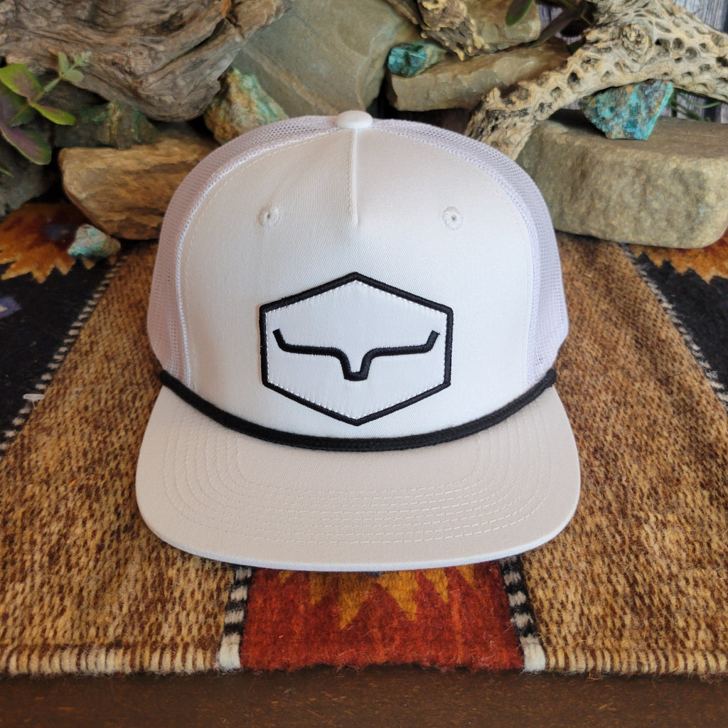 A white trucker cap with mesh paneling, featuring a black logo.