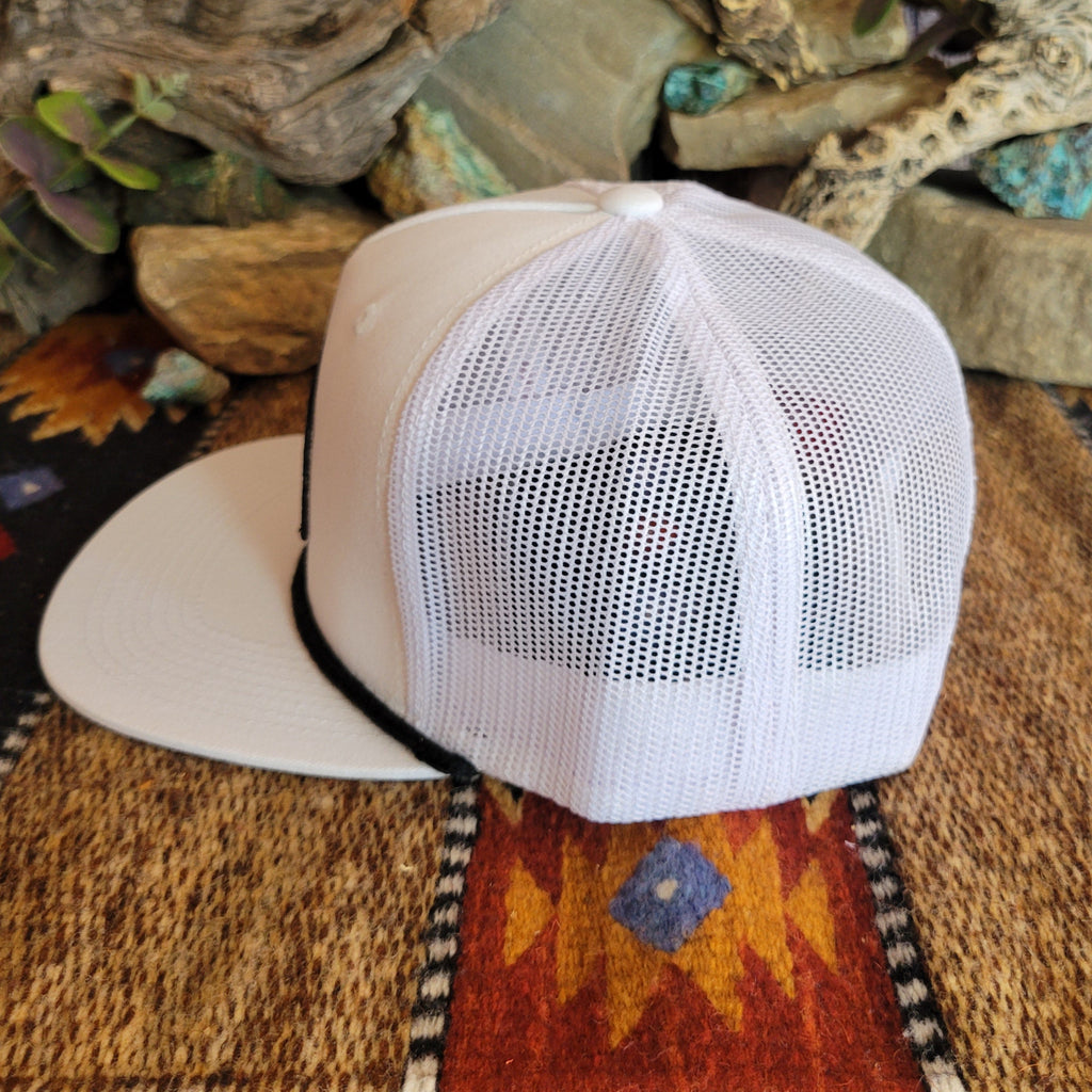 A white trucker cap with mesh paneling on the sides.