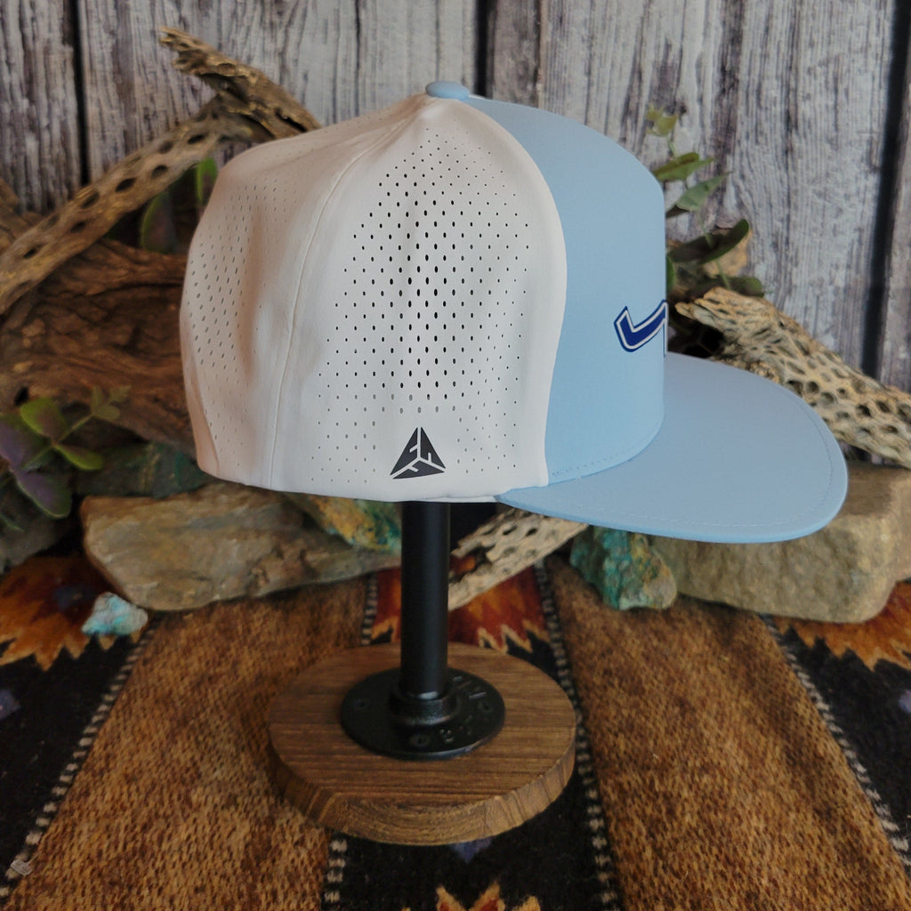 Light blue cap with a dark blue logo and white breathable fabric panel.