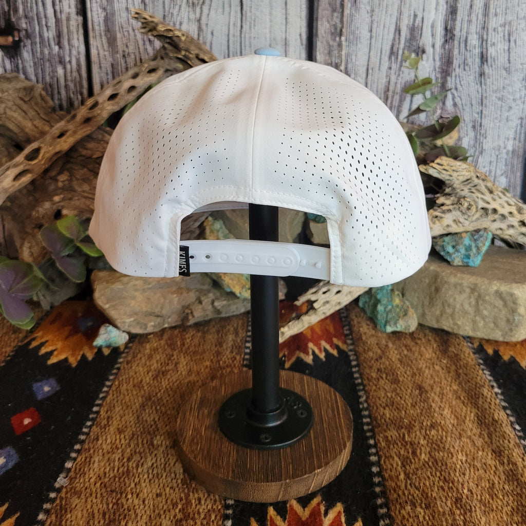 White breathable fabric and snap-back closure found on the back of the cap.