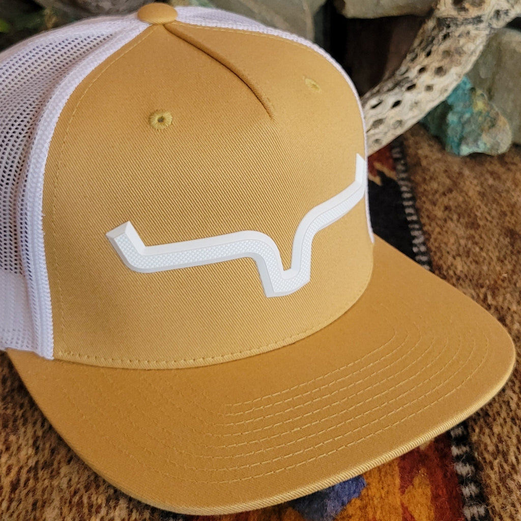 Close-up view of the white Kimes Ranch logo contrasting with the yellow.