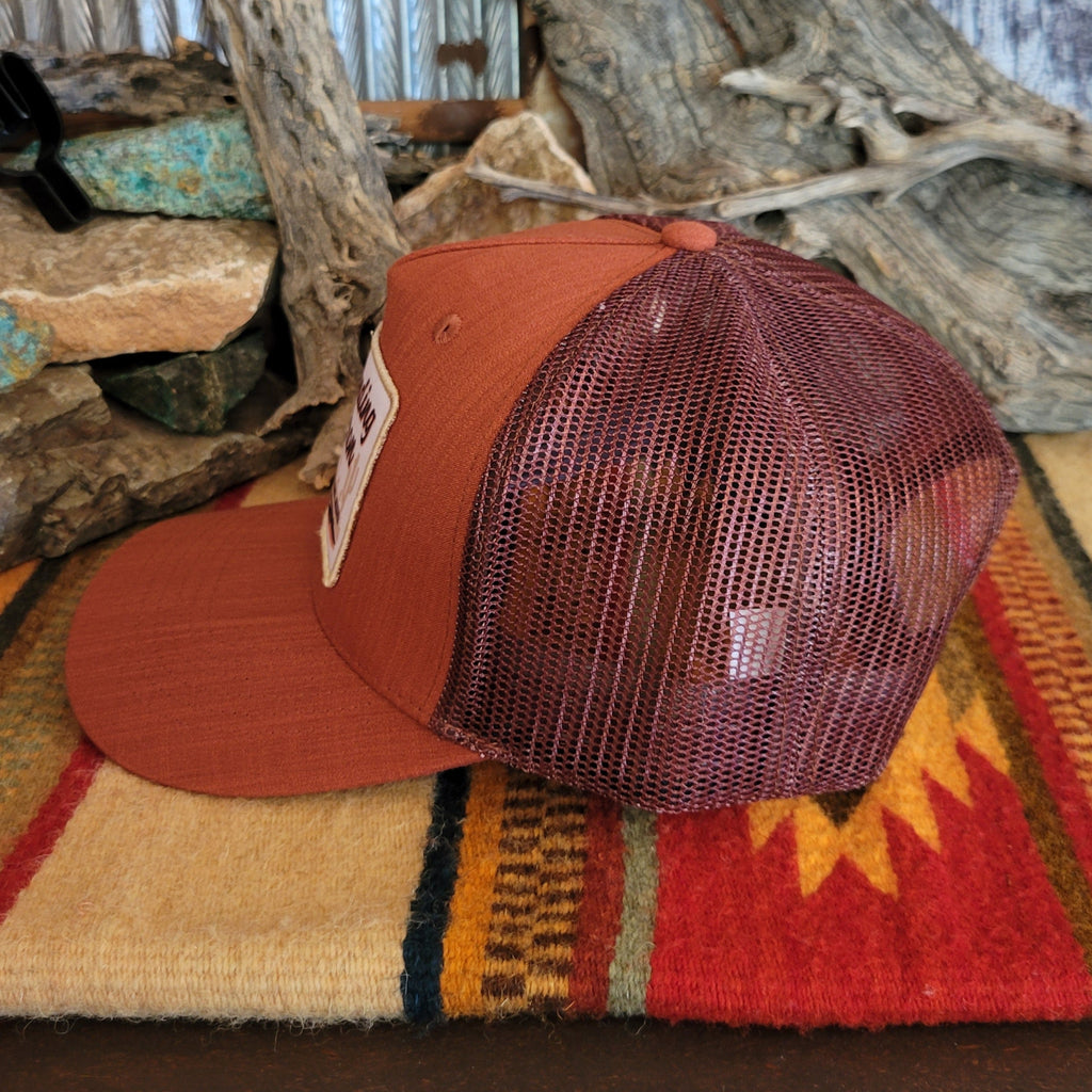 Maroon mesh paneling on the hat.