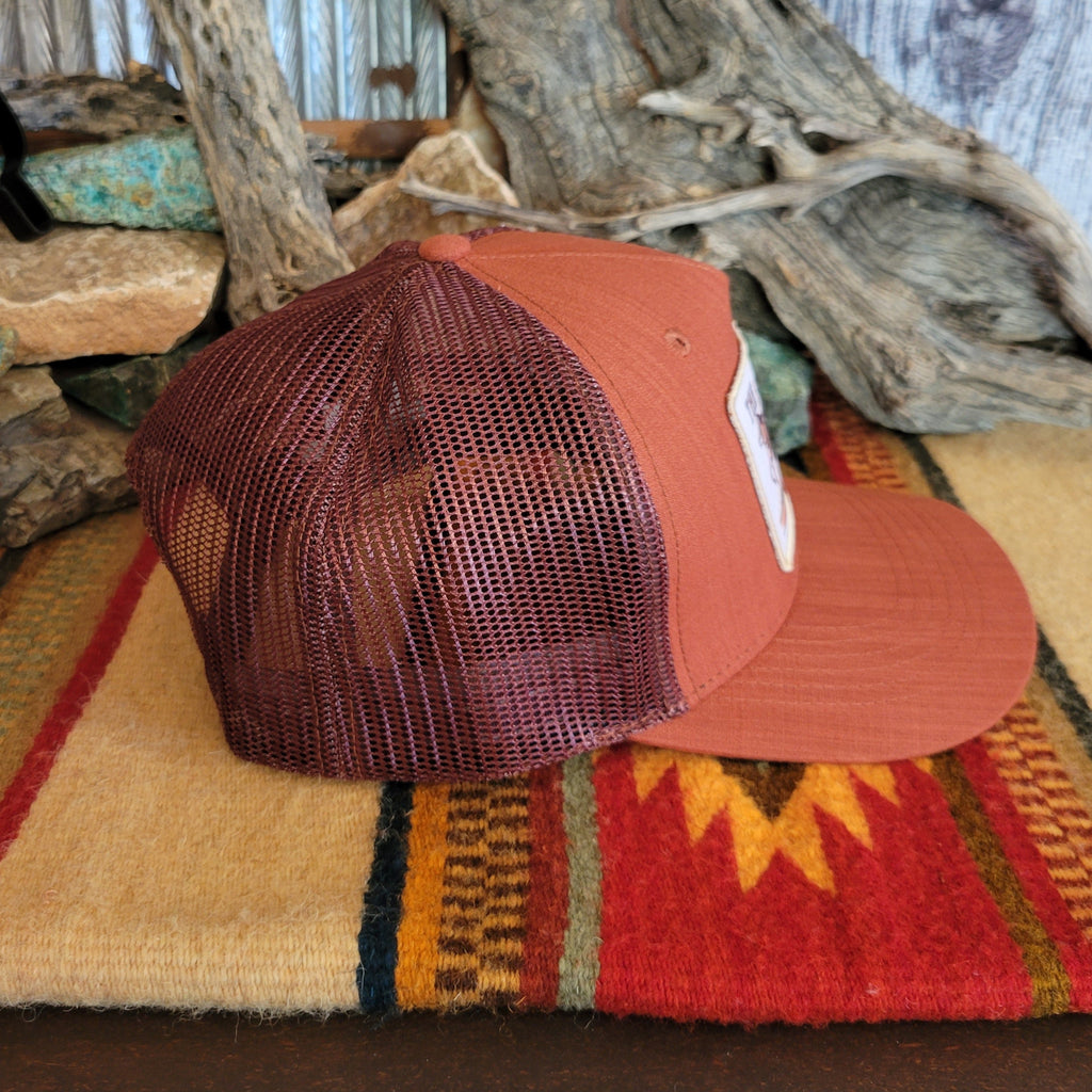 Maroon mesh paneling on the hat.