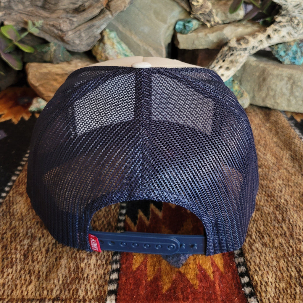 Navy blue mesh paneling and snap-back closure.