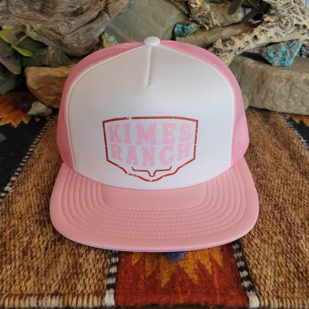 A pink trucker cap with pink mesh paneling, featuring the "Kimes Ranch" logo.