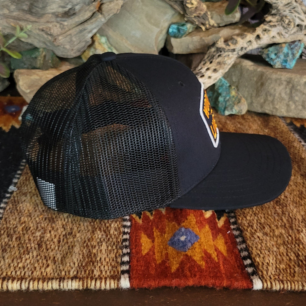 The side of the cap features the black mesh paneling.