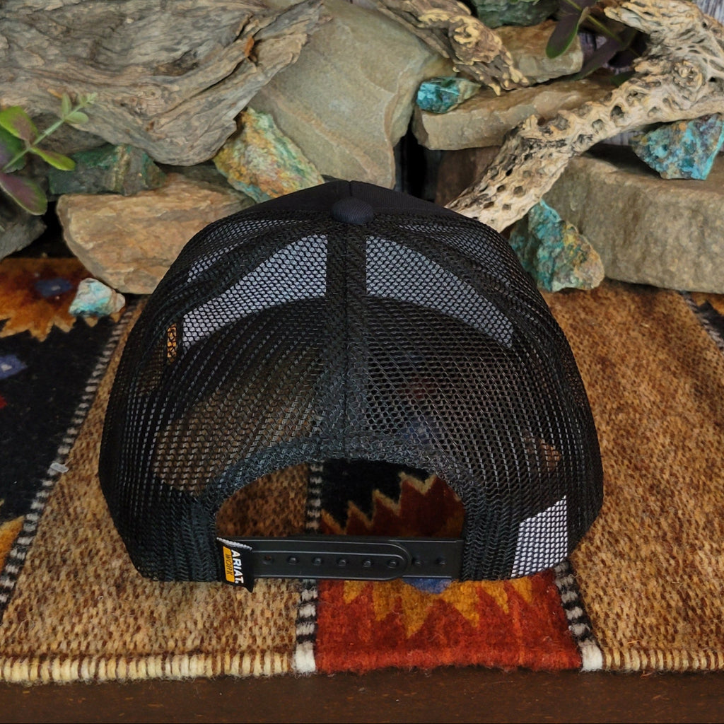 The back of the cap features the mesh paneling and adjustable snap-back closure.