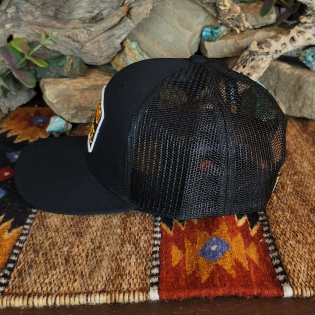 The side of the cap features the black mesh paneling.
