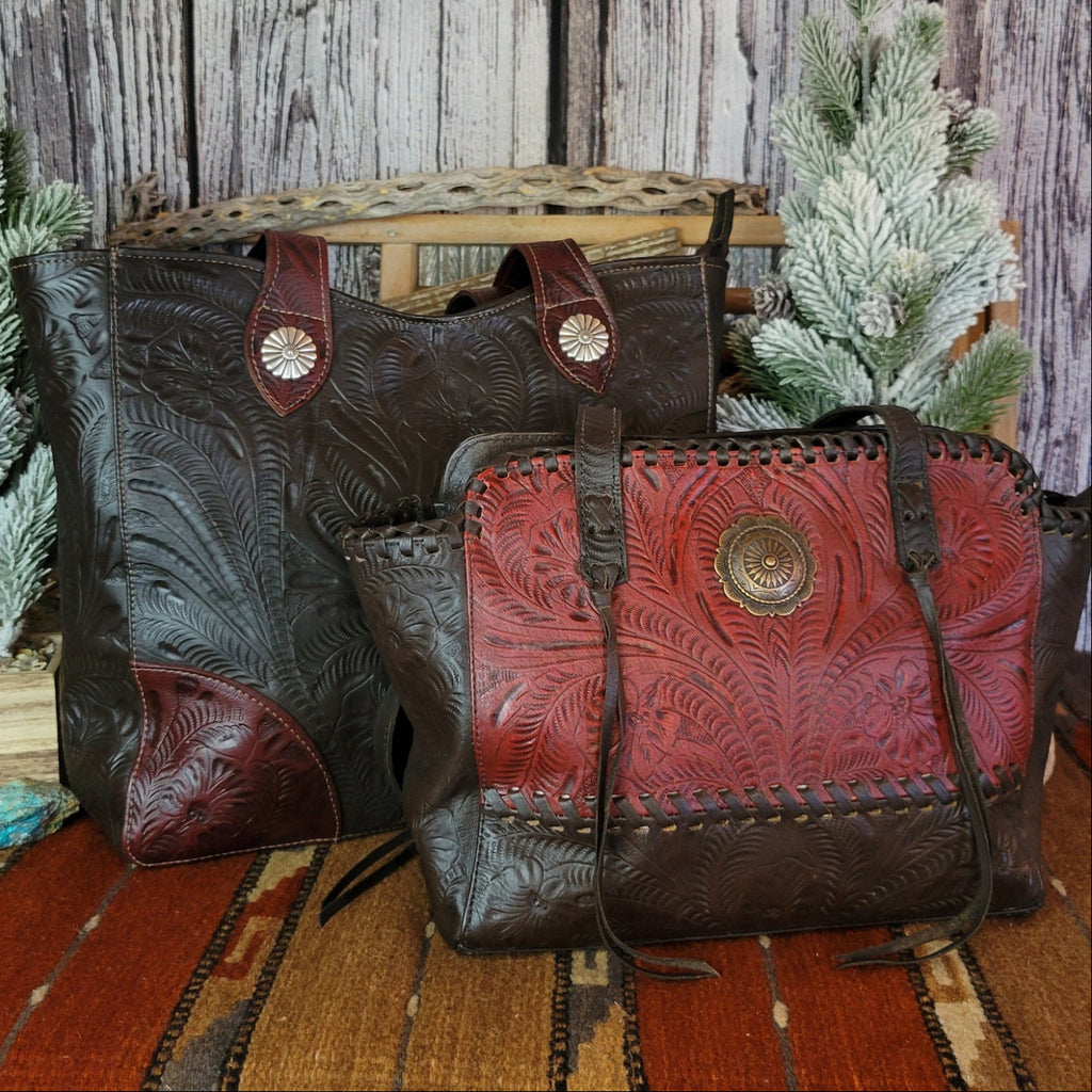 Hand-stained red and rich brown, tote has concealed carry pockets and hand-tooled floral designs with matching tote pictured.