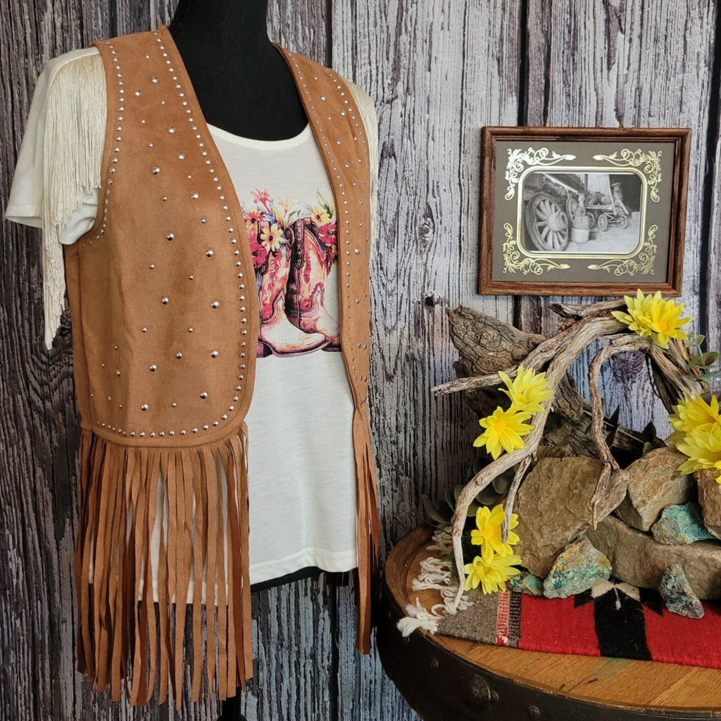 Brown vest with silver studs and fringe.