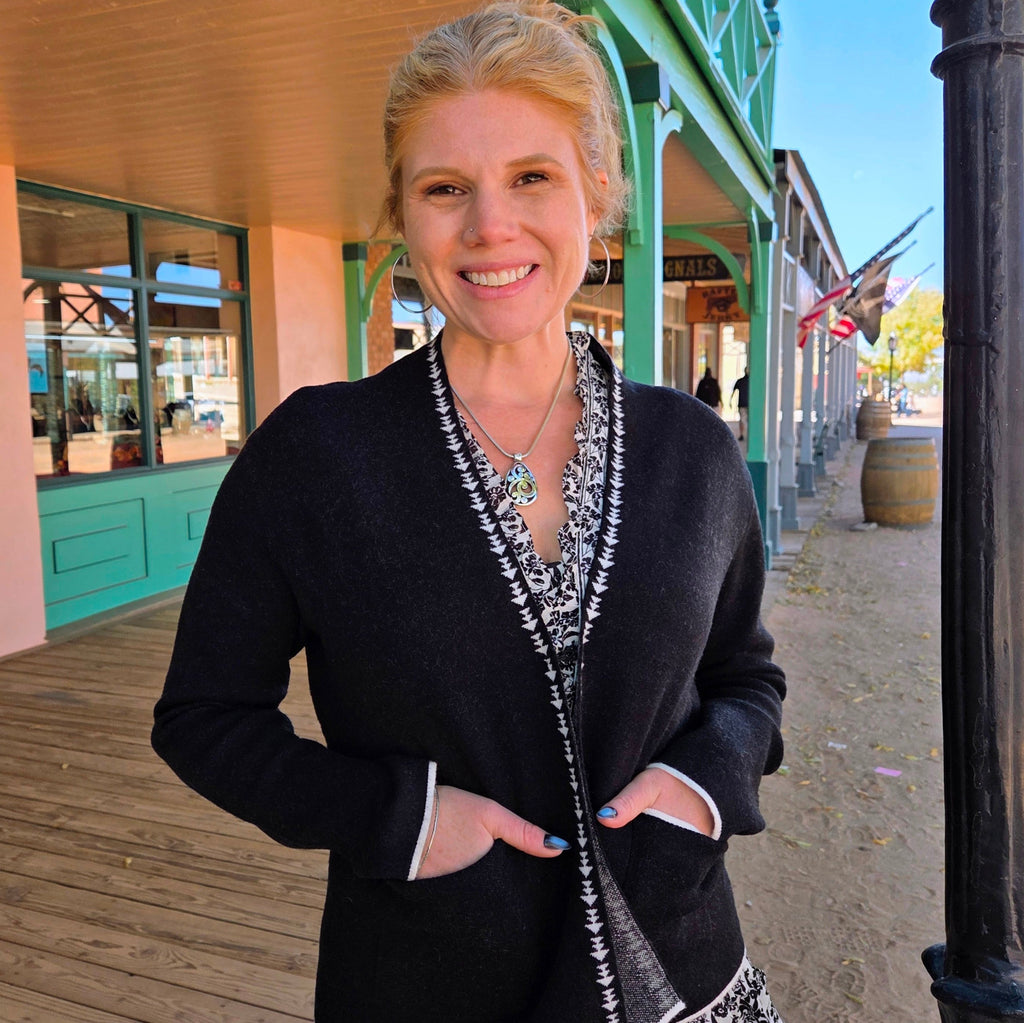 Women's Cardigan "Margo" by Venario Black w/ white details  w/ front pockets on model  