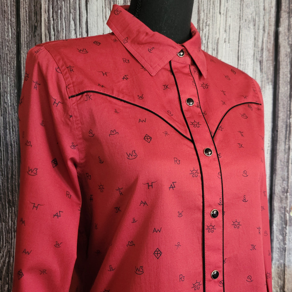 A close-up of the cattle brand print and snap buttons.