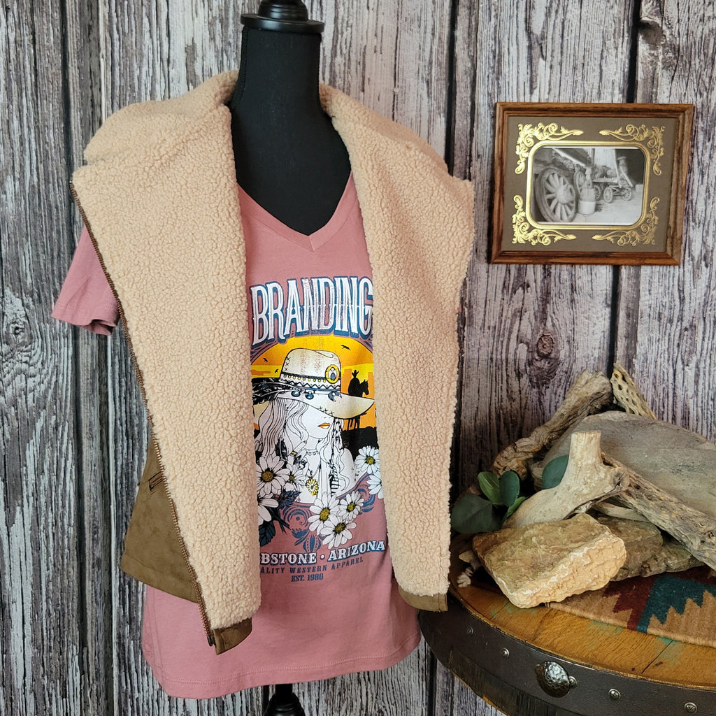 Brown vest with beige fleece interior and collar, featuring multiple front pockets.
