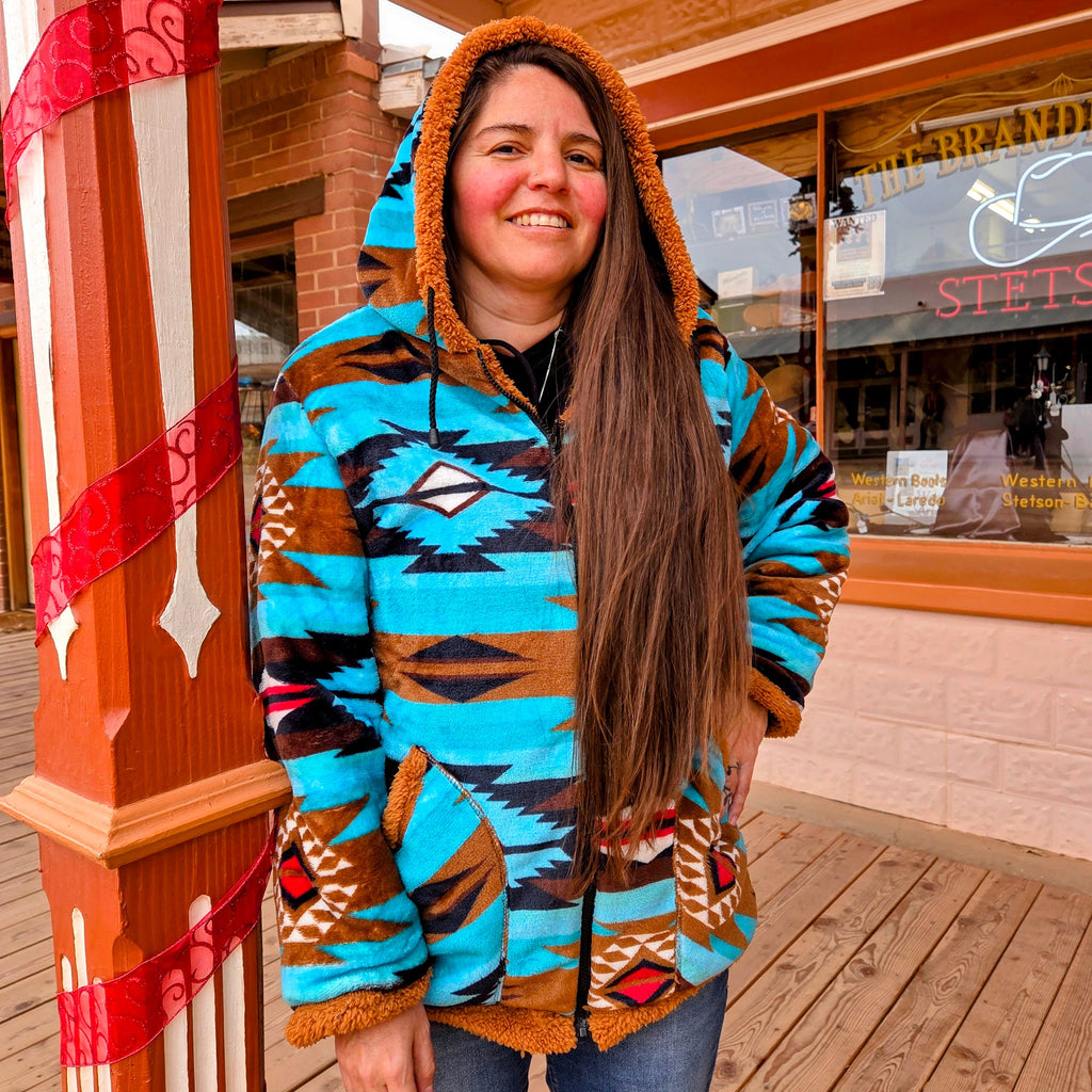 Women's Fleece Jacket by All Weather Outwear turquoise aztec design on model