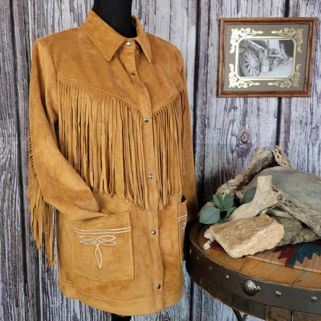 Tan jacket with front to back fringe, button-up design, and front pockets.