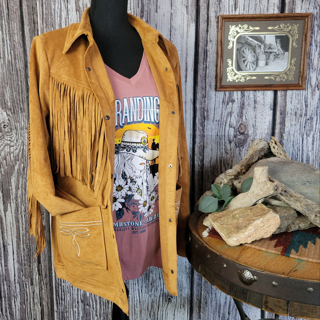 Tan jacket with front to back fringe, button-up design, and front pockets.