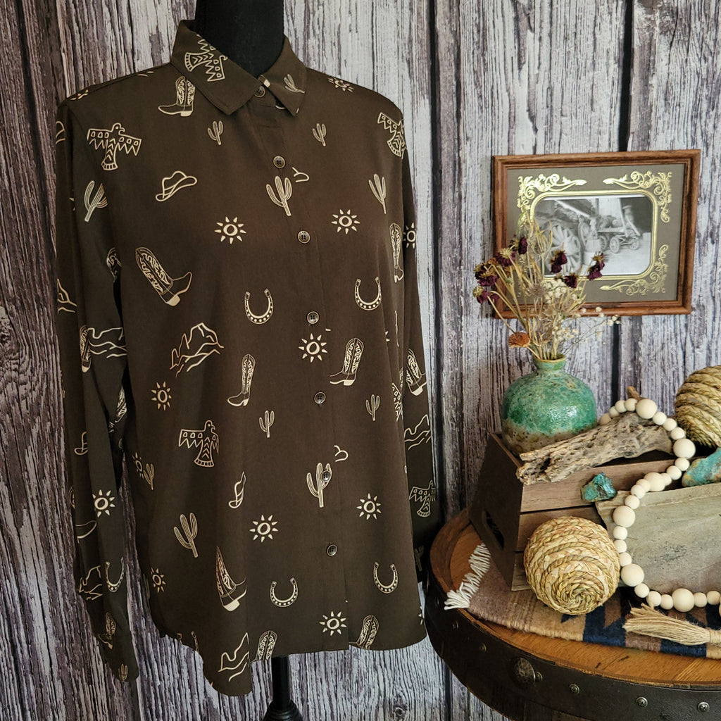 Brown button down long sleeved shirt with western print.