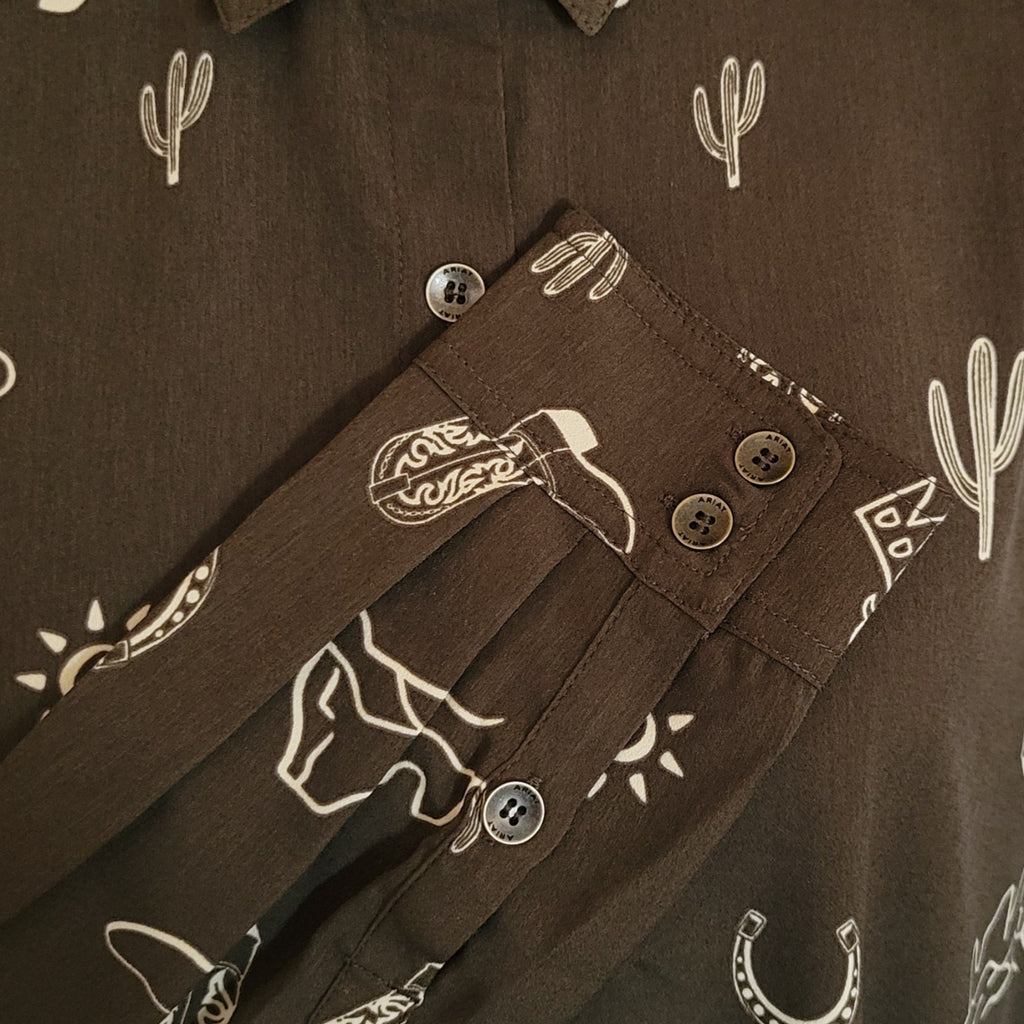 Close-up of western print and buttons on the sleeve.