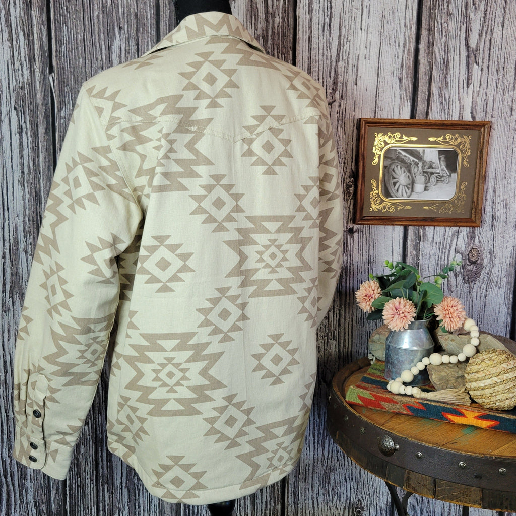 Cream colored shirt jacket with insulted interior and tan southwestern print.