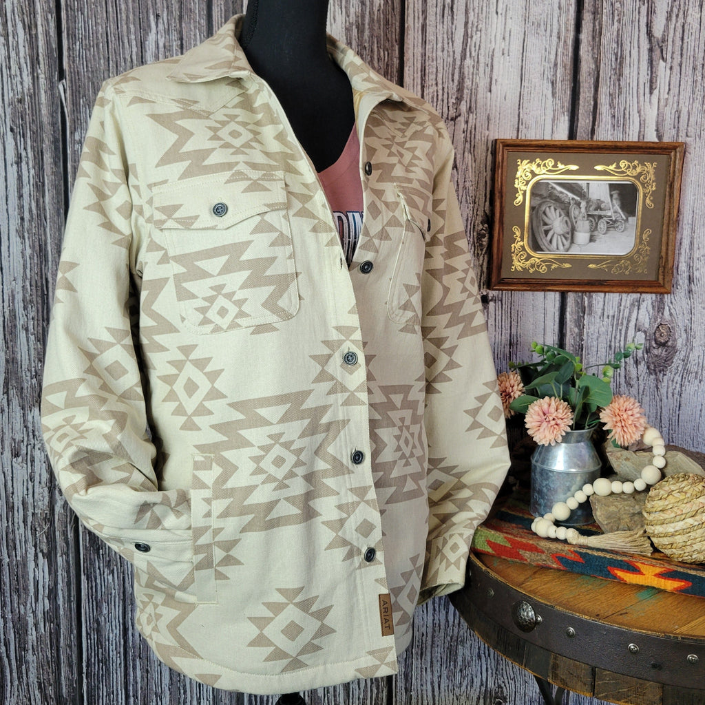 Cream colored shirt jacket with insulted interior and tan southwestern print.