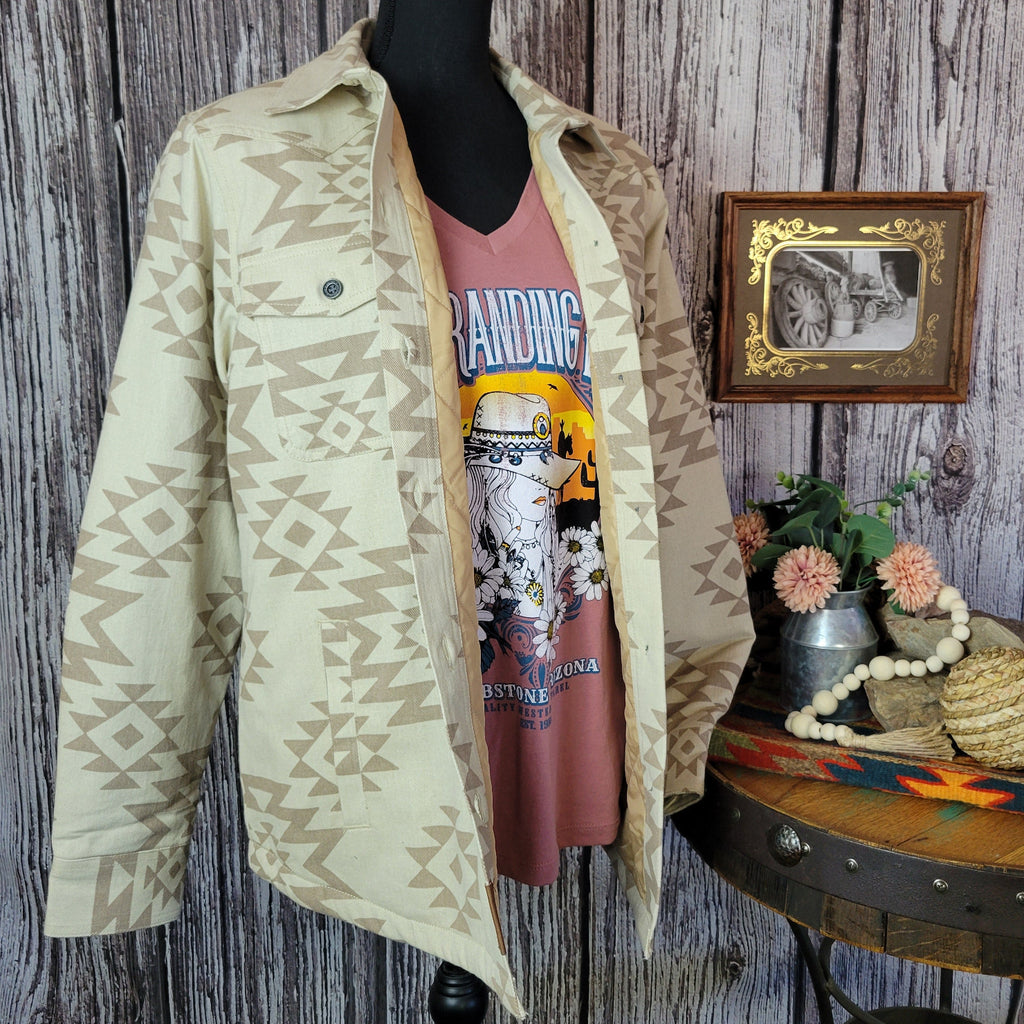 Cream colored shirt jacket with insulted interior and tan southwestern print.