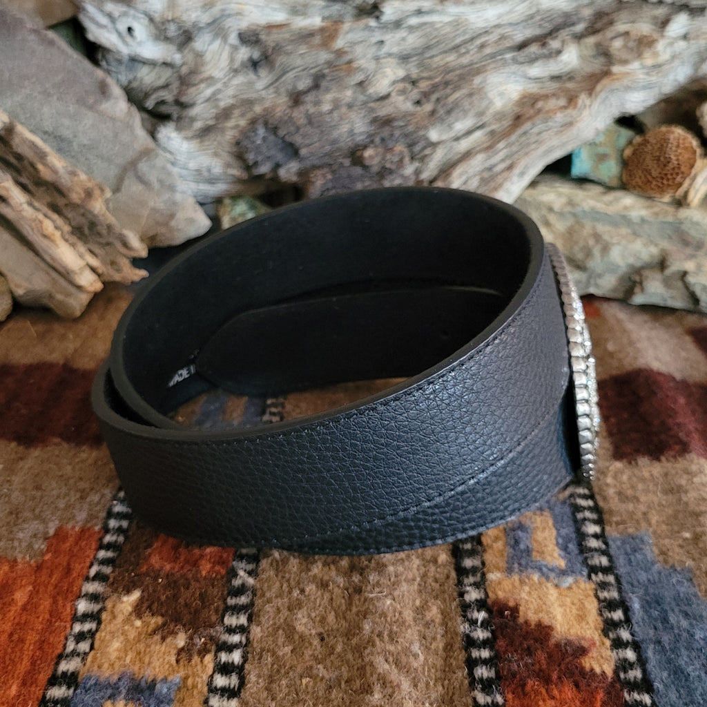 Textured, black leather belt with silver rhinestone buckle and black accents.