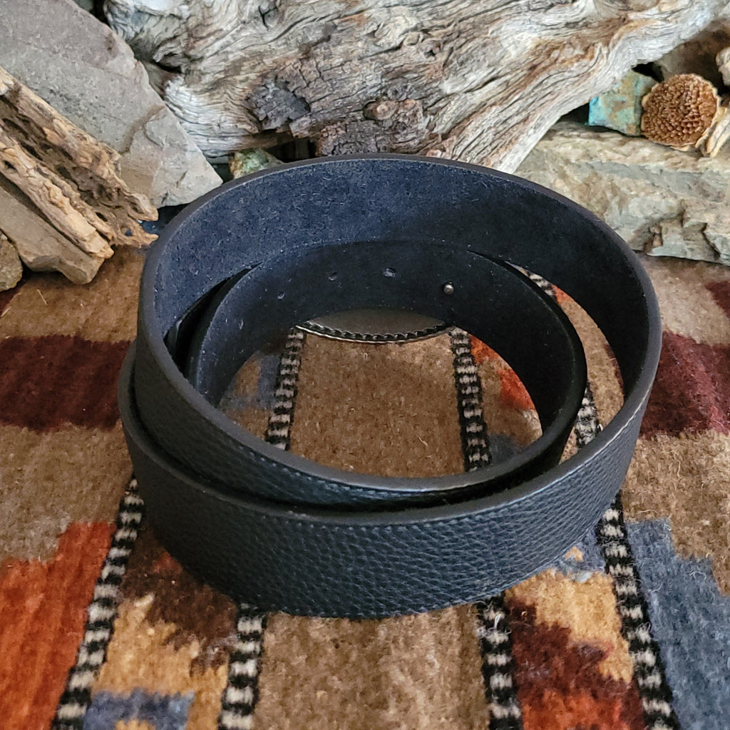 Textured, black leather belt with silver rhinestone buckle and black accents.