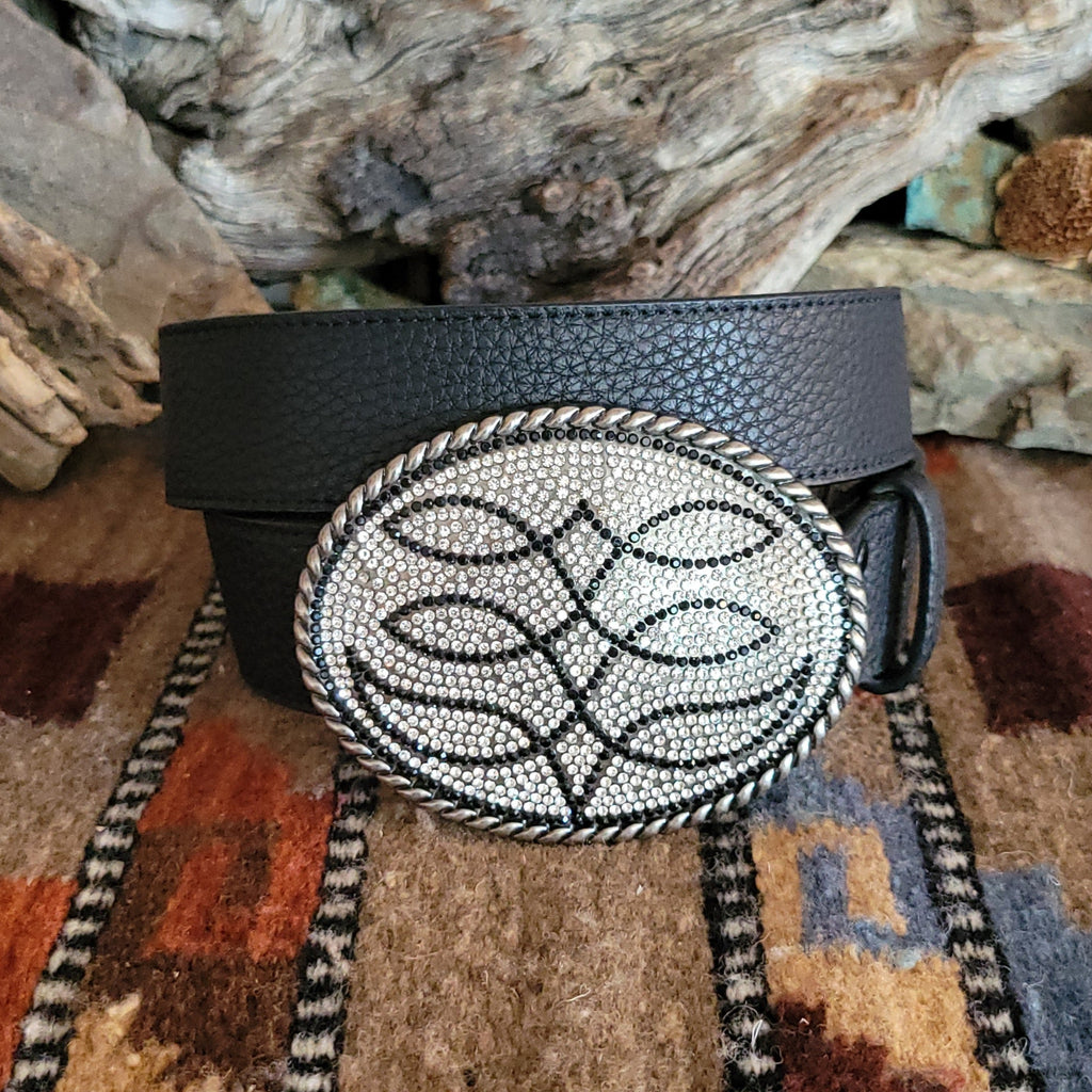 Textured, black leather belt with silver rhinestone buckle and black accents.