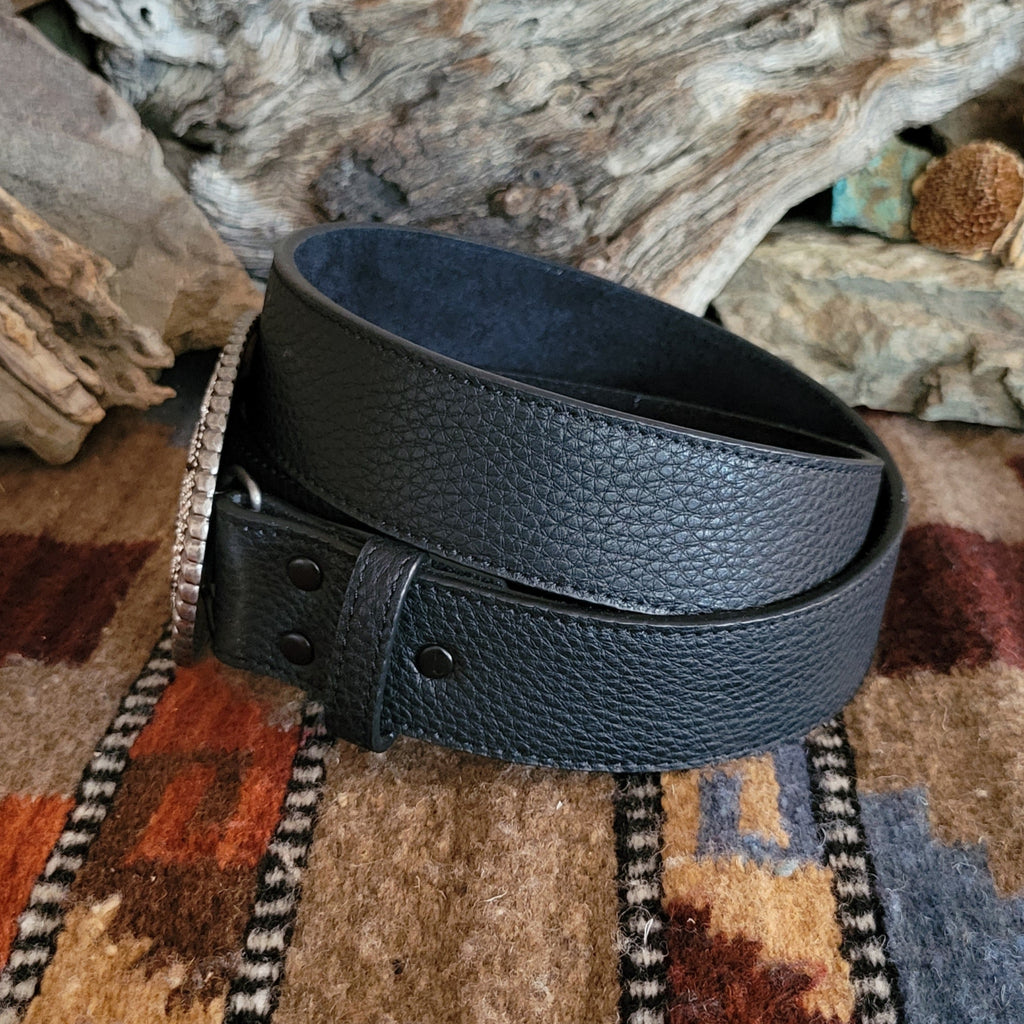 Textured, black leather belt with silver rhinestone buckle and black accents.