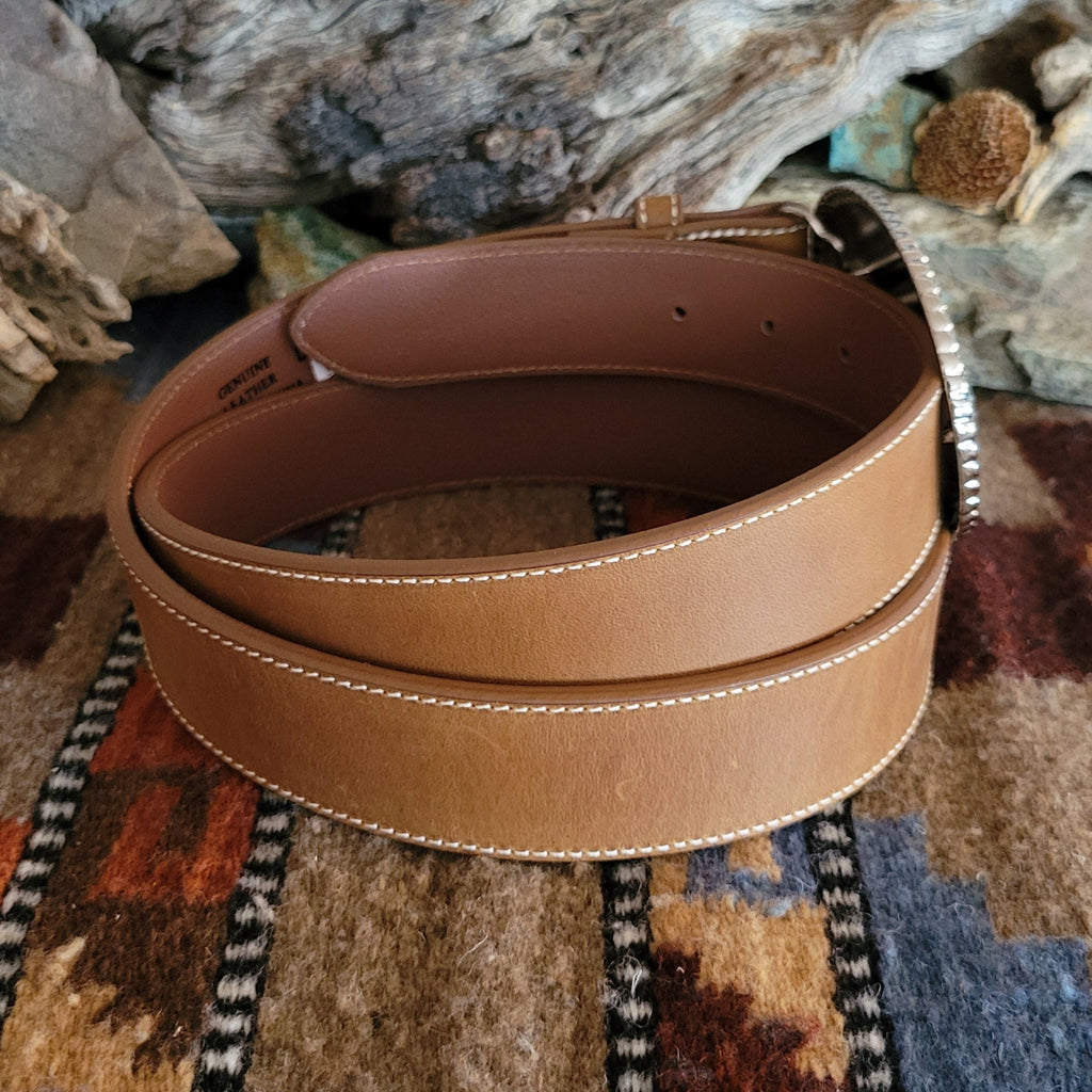 Smooth, brown leather belt with rhinestone buckle.