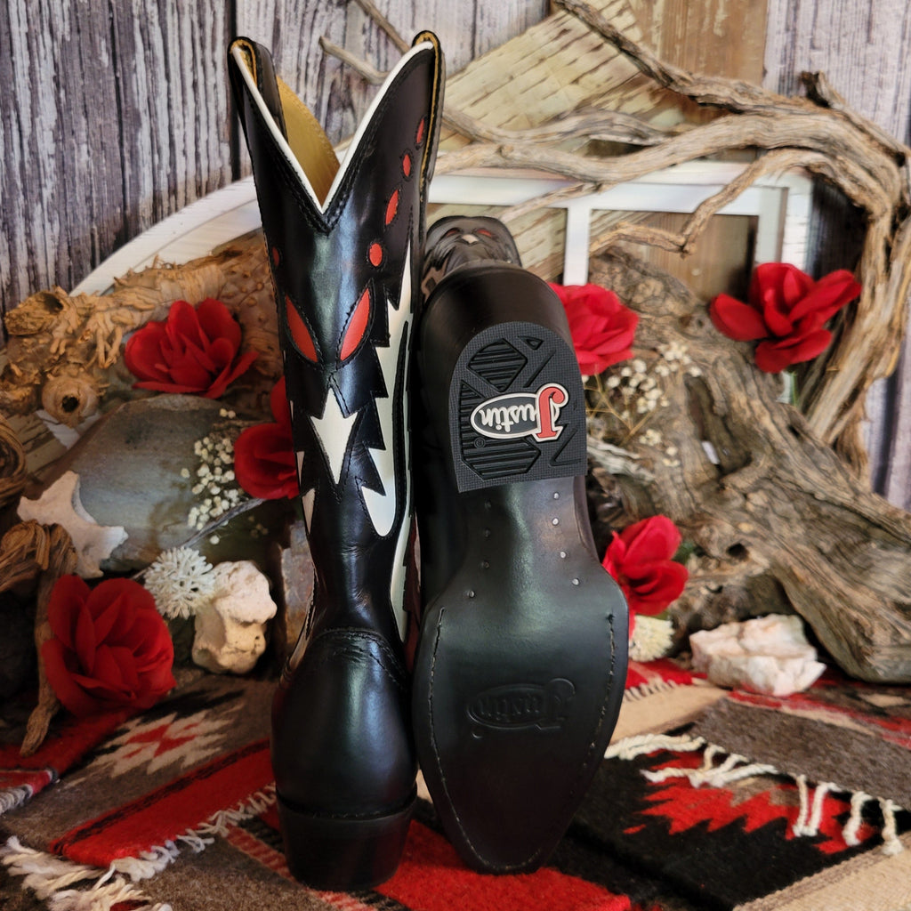 Black leather boot with snip toe and decorative white and red cut-out details on the shaft with a leather and rubber sole.