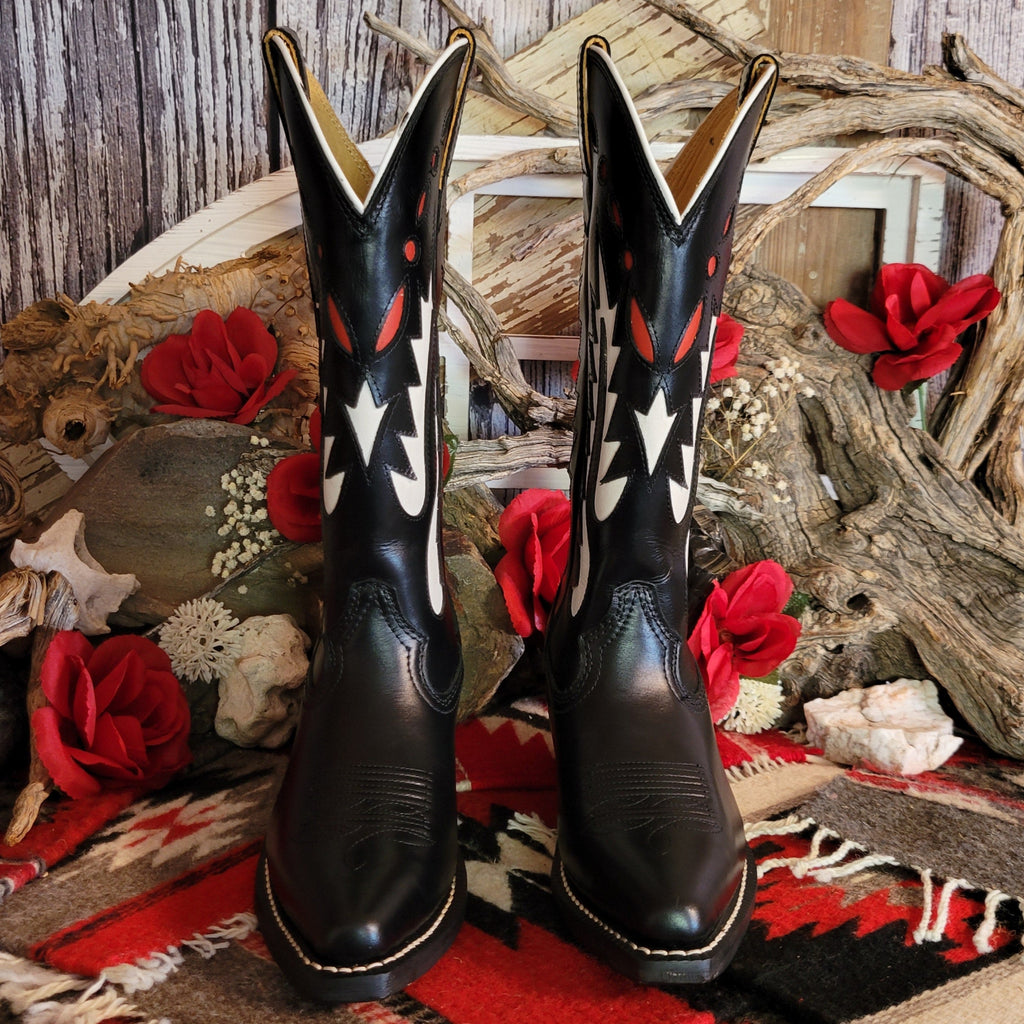 Black leather boot with snip toe and decorative white and red cut-out details on the shaft.
