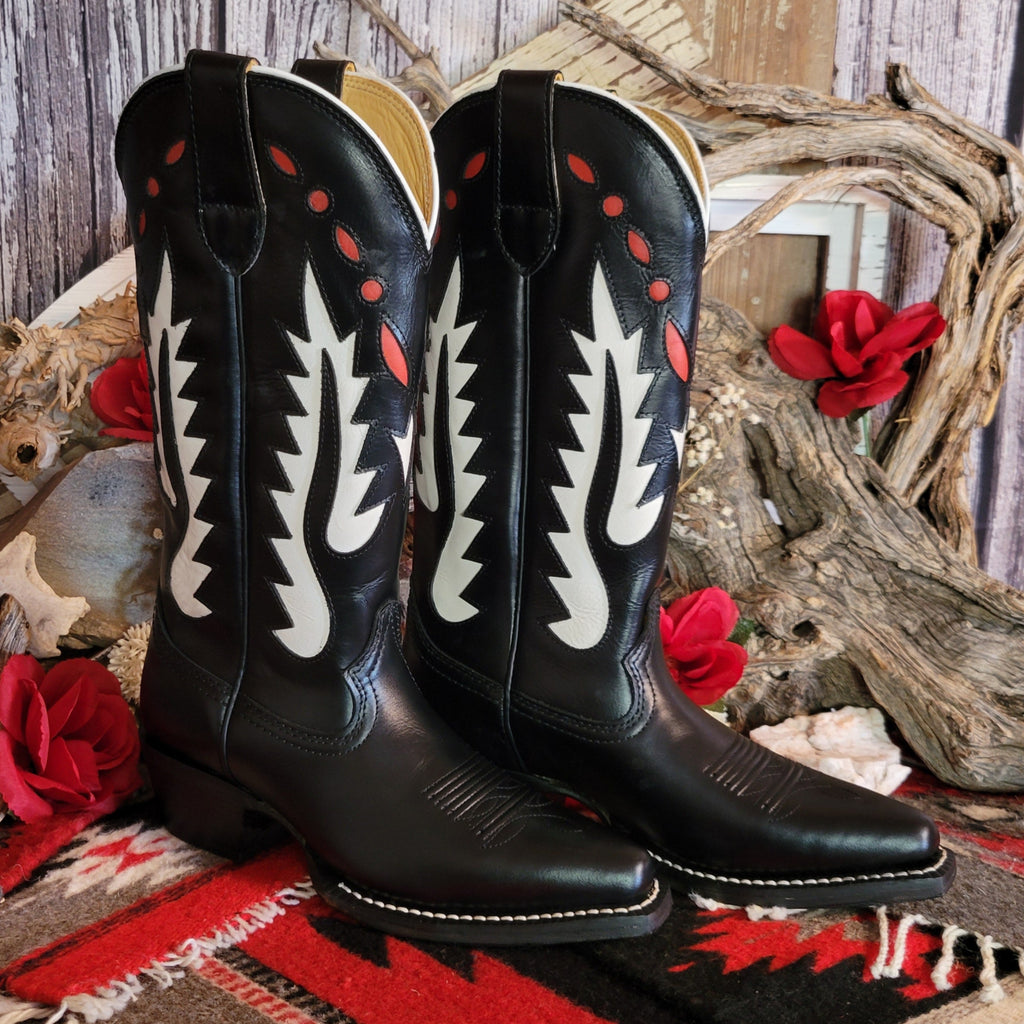 Black leather boot with snip toe and decorative white and red cut-out details on the shaft.