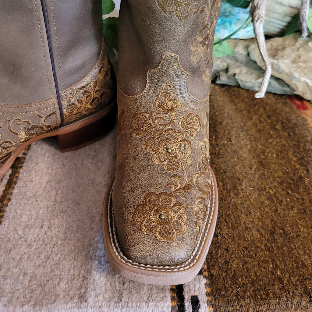 Close-up of the stitched floral details on the toe.