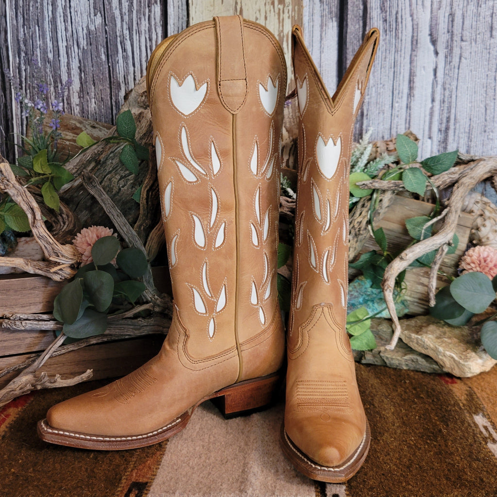 Tan leather snip toe boots with white floral cut-outs on the shaft.